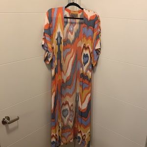 Beautiful and high quality cover up/shawl with sleeves.